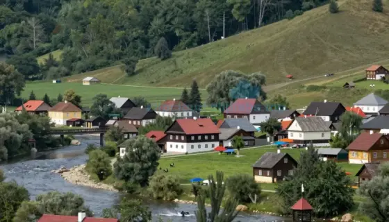 A scenic landscape of Borsod Abaúj-Zemplén County in Hungary, featuring rolling hills, lush green forests, a winding river, traditional Hungarian wooden houses with red roofs, and people in folk costumes celebrating a local festival with banners and decorations