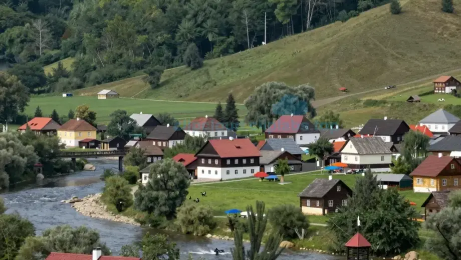A scenic landscape of Borsod Abaúj-Zemplén County in Hungary, featuring rolling hills, lush green forests, a winding river, traditional Hungarian wooden houses with red roofs, and people in folk costumes celebrating a local festival with banners and decorations