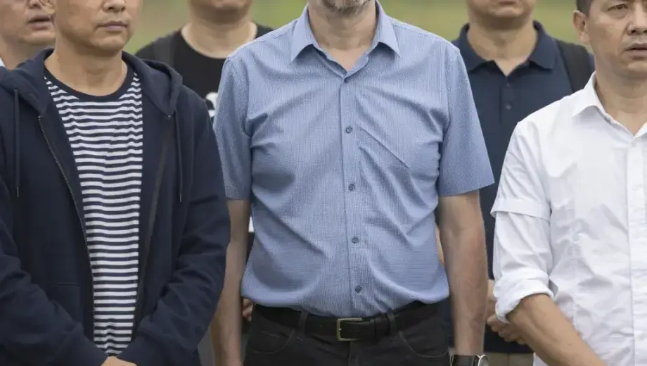 A group of people standing together in a natural outdoor setting, possibly a park or countryside, with a sense of unexpected arrival or gathering, depicting Dr. Zima András and his companions in a moment of serendipitous meeting, with expressive faces and casual yet thoughtful attire, conveying a narrative moment of connection and surprise