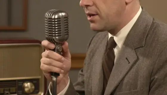 A vintage-style radio studio scene with a man in a suit (Hildebrand Krisztián) speaking into a classic microphone, surrounded by vintage audio equipment and warm lighting, evoking a 1950s Hungarian radio broadcast atmosphere