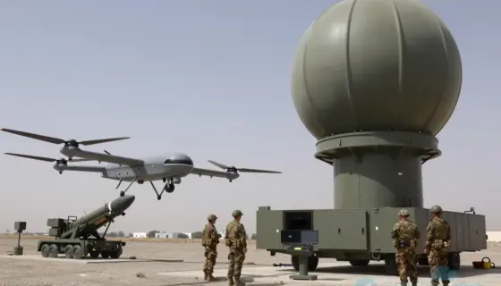 A realistic depiction of the Israeli army's new air warning system: a high-tech radar dome and sensor array on a military base, a hovering drone in the foreground, a rocket launch pad with a rocket in the background, Israeli soldiers in uniform monitoring the system, all set against a clear sky with subtle military equipment details