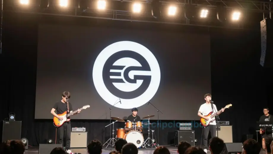A concert stage with a band performing, featuring a prominent Egr logo or symbol, warm stage lighting, audience in the background, and a clear indication of a Thursday event