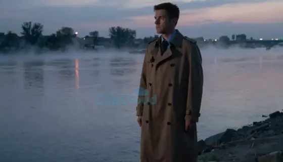 A detective in a trench coat stands on a riverbank at dusk, gazing at the Tisza River with a determined expression, subtle reflections of police lights on the water, atmospheric mist, cinematic lighting