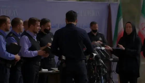 A dramatic scene showing coordinated Iranian authorities responding to a press conference, with police or security personnel standing near journalists, symbolic representation of press freedom being challenged, and subtle visual cues of a hidden investigation into child abuse, all rendered in a realistic style