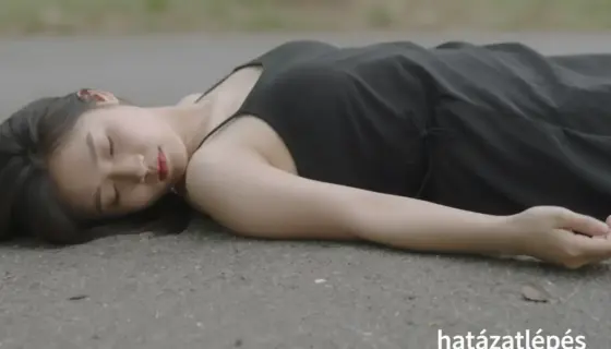A person lying on the ground after a nap, with a blurred or faded edge at the boundary of their body due to a 'határatlépés' (boundary step) effect, in a natural outdoor setting with soft lighting